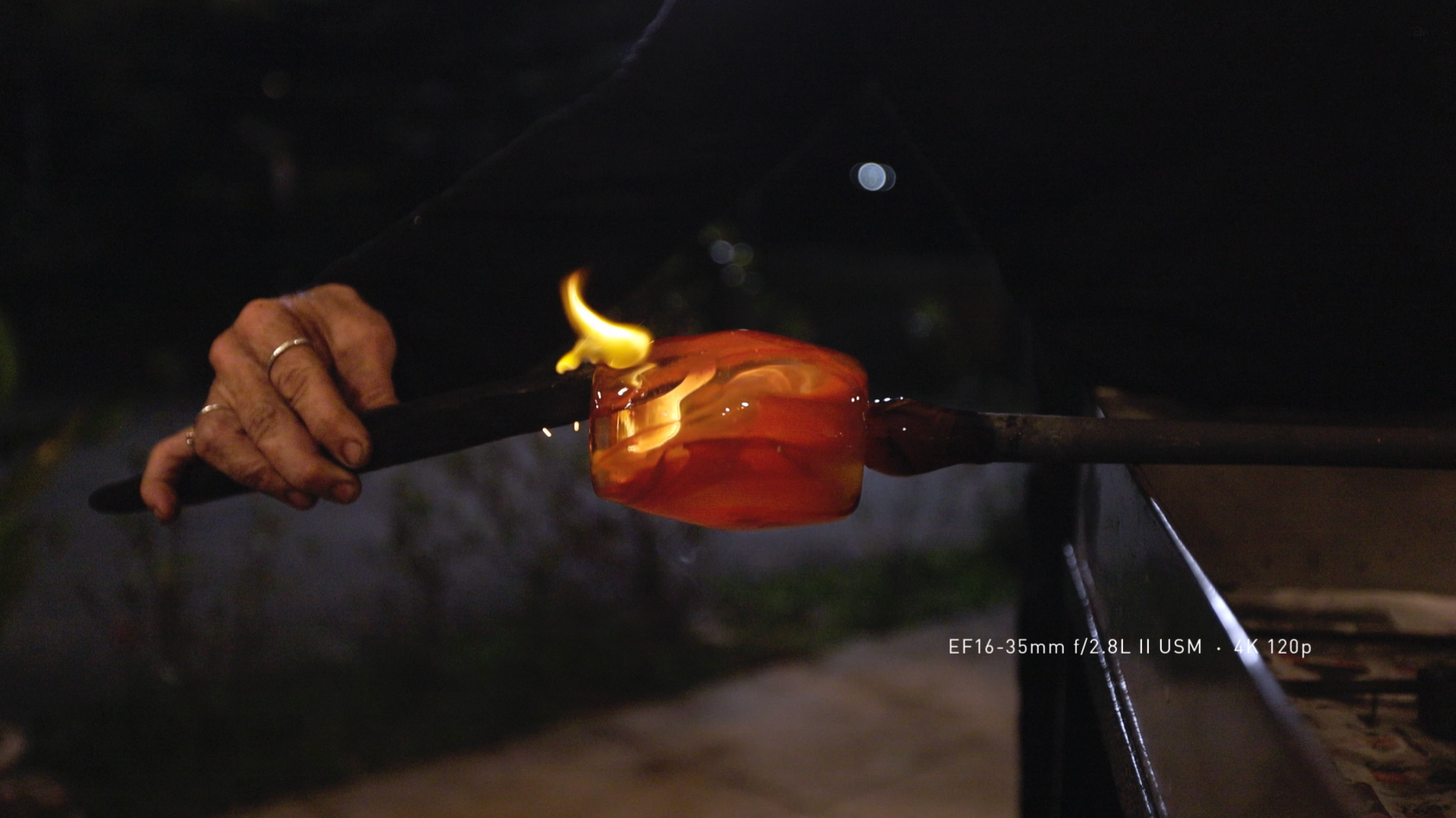 Cinematic shot of glassmaking that shows off all the details in darks