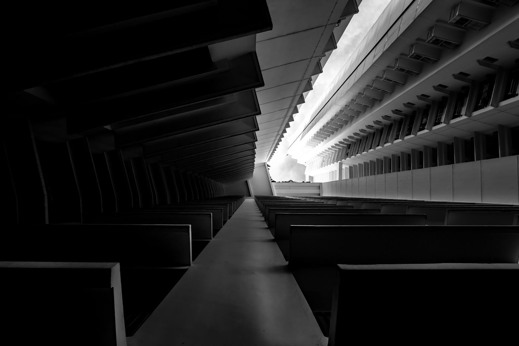 Black & White Fine Art Photography displaying the angles of a buildings as a tunnel